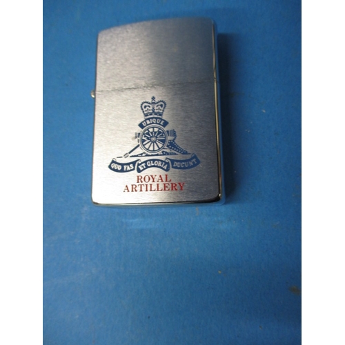 93 - A vintage Royal Artillery Zippo lighter in near unused condition