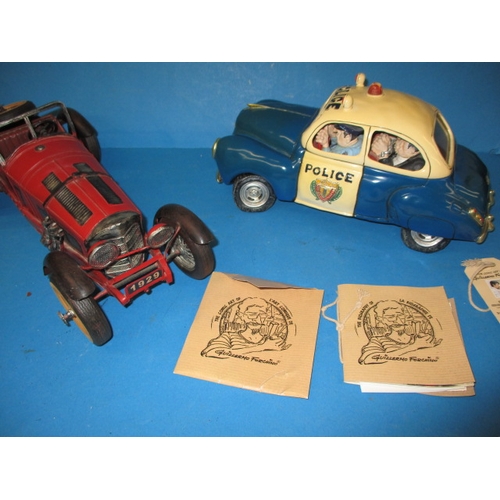 99 - A Guillermo Forchino comic art police car and a model sports car, both in boxes