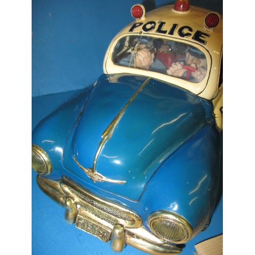 99 - A Guillermo Forchino comic art police car and a model sports car, both in boxes