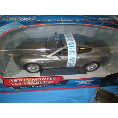 101 - A quantity of die-cast model vehicles, to include a 1:18 scale Aston Martin V12 Vanquish, all in unu... 