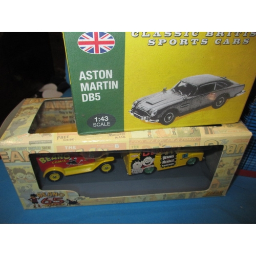 101 - A quantity of die-cast model vehicles, to include a 1:18 scale Aston Martin V12 Vanquish, all in unu... 