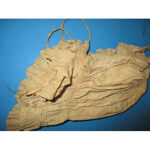 112 - An antique baby bonnet and gown, having age-related marks and ware