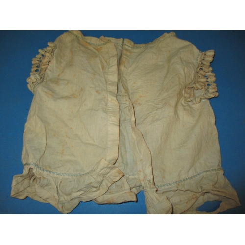 112 - An antique baby bonnet and gown, having age-related marks and ware