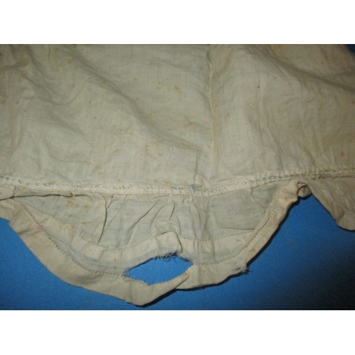 112 - An antique baby bonnet and gown, having age-related marks and ware