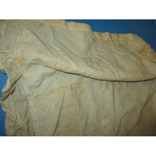 112 - An antique baby bonnet and gown, having age-related marks and ware