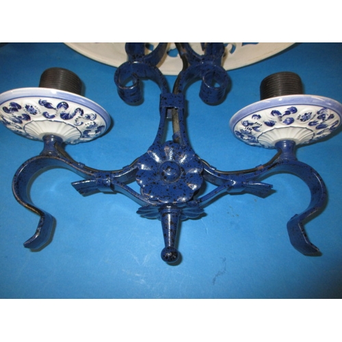 132 - A pair of continental ceramic and iron ceiling lights, blud glaze decoration and twin branch, both i... 