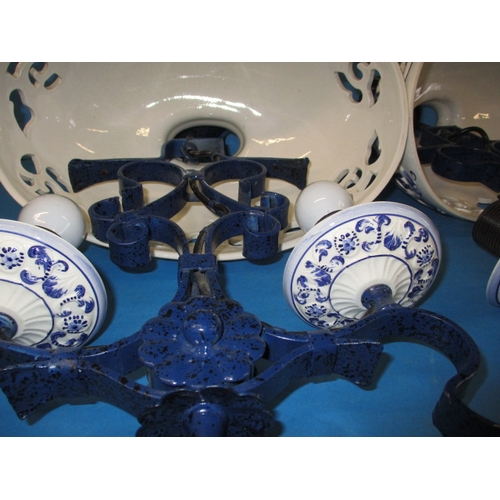 132 - A pair of continental ceramic and iron ceiling lights, blud glaze decoration and twin branch, both i... 