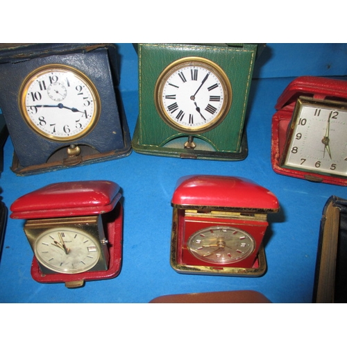 181 - A quantity of vintage travel clocks, various makers, all in used condition none tested as to functio... 