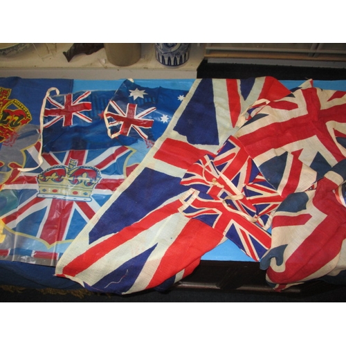 213 - A quantity of 1950s and other coronation bunting and related flags, all in used condition with some ... 