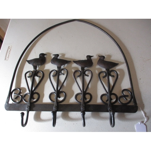 220 - A wrought iron fire screen, magazine rack and coat hook. In useable pre-owned condition