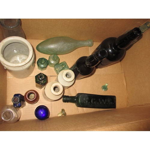 228 - A collection of antique and later glass and stoneware bottles, various makers, some local, all in us... 