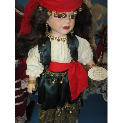 231 - 6 porcelain collectors dolls on display stands, each approx. 44cm high, all in pre-owned cabinet dis... 