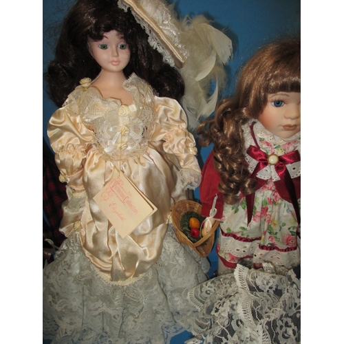 231 - 6 porcelain collectors dolls on display stands, each approx. 44cm high, all in pre-owned cabinet dis... 