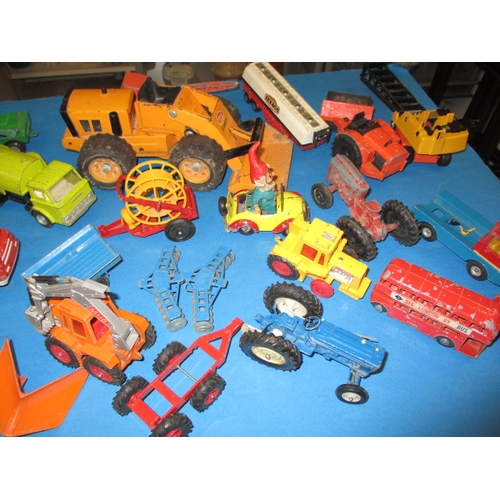 235 - A large quantity of vintage die-cast model vehicles, to include tractors and farm machines, all in p... 