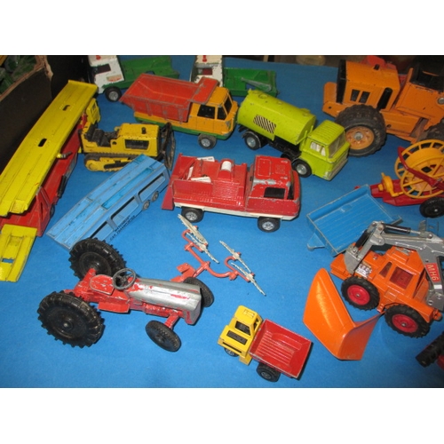 235 - A large quantity of vintage die-cast model vehicles, to include tractors and farm machines, all in p... 