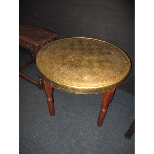 243 - A vintage brass top chess table and an oak joint stool, both in useable pre-owned condition