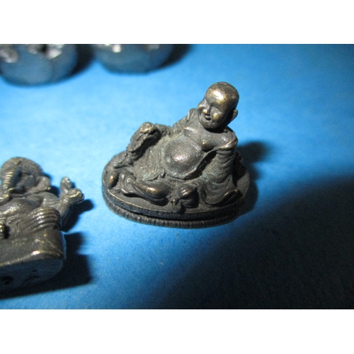 283 - A parcel of Asian cast metal figures, various sizes but approx.  26mm high, various metals, all in g... 