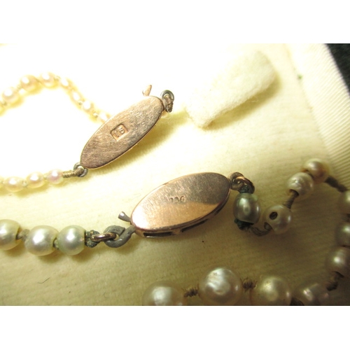 133 - A quantity of vintage necklaces, to include pearl examples with gold clasps, coral and amber, all in... 