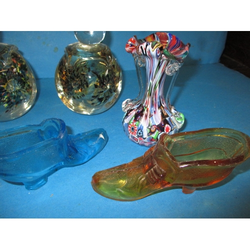 343 - A quantity of decorative glass items, to include hand-blown paperweights and moulded shoes, some wit... 