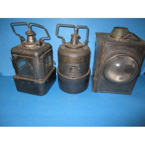 324 - Three antique railway hand lamps, all with burners, various railway company’s,  all in used conditio... 