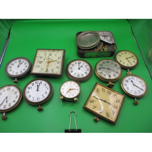 335 - A quantity of travel clock movements, all in need of repair