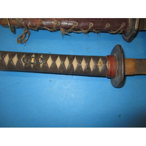 312 - Two vintage Japanese Katana swords, both with use-related marks and probably dating WWII period