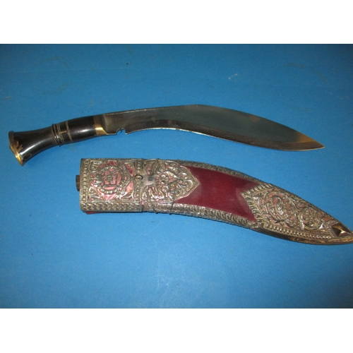 314 - A Gurkha kukri having Royal military police insignia in the white metal mount, in used condition, ap... 