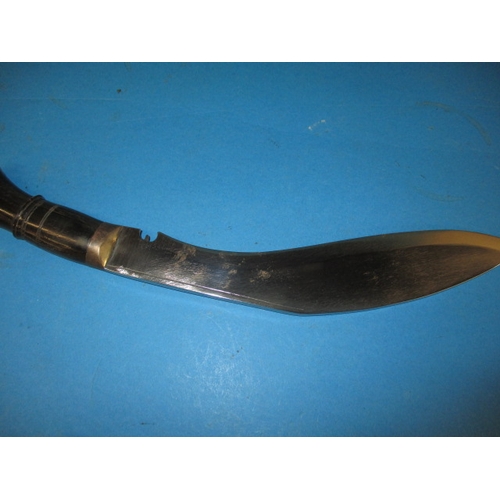 314 - A Gurkha kukri having Royal military police insignia in the white metal mount, in used condition, ap... 