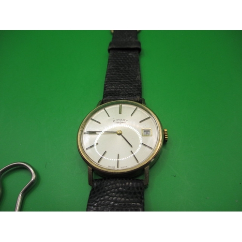 99 - A vintage gents 9ct gold Rotary wrist watch with date window, having general use-related marks and n... 