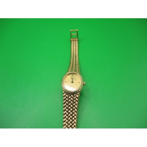 100 - A vintage ladies Omega De Ville watch with integral yellow metal strap, in pre-owned condition and n... 