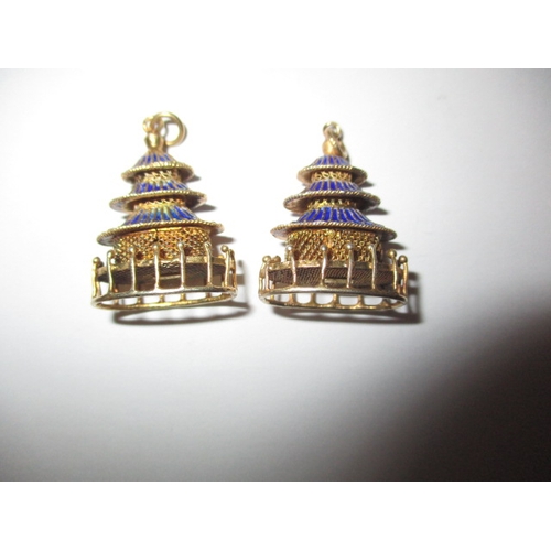 144 - A pair of gilt silver and enamel earring/pendants in the form of pagodas, in good used condition