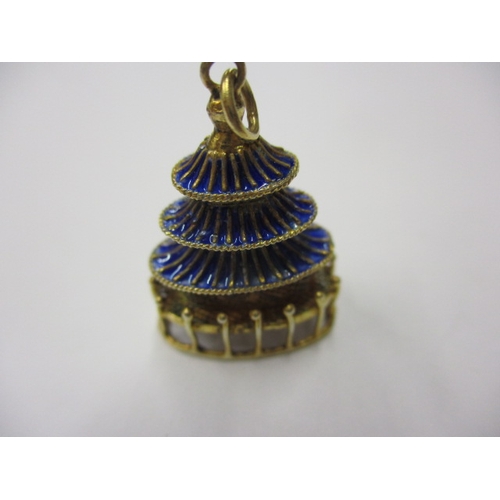 144 - A pair of gilt silver and enamel earring/pendants in the form of pagodas, in good used condition