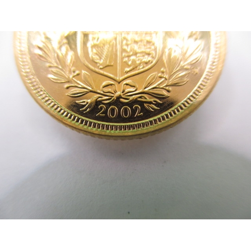 214 - A Queen Elizabeth II gold half sovereign dated 2002, a very fine grade coin with light use related m... 