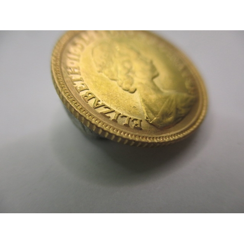 218 - A Queen Elizabeth II gold half sovereign dated 1982, a very fine grade coin with light use related m... 