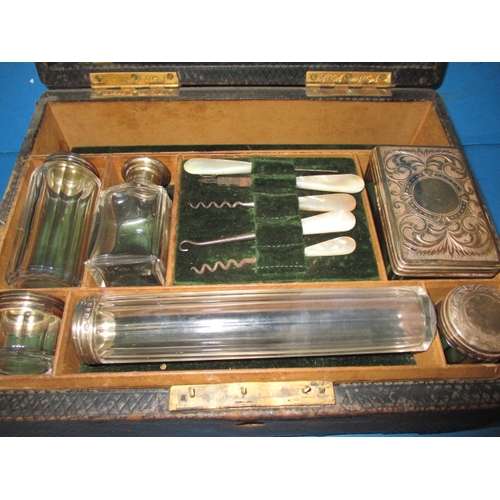 153 - A late 19th century valet box with contents of silver top jars, Birmingham hallmark, in well used co... 