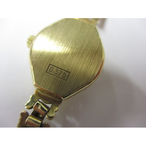 101 - A 1991 IMADO 9ct gold watch and strap, with original box and papers and in good working order, appro... 