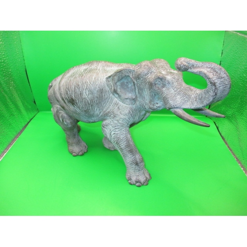 269 - An antique cast bronze elephant, having been used in a garden display for the late 30+ years, approx... 