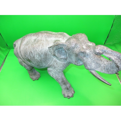 269 - An antique cast bronze elephant, having been used in a garden display for the late 30+ years, approx... 