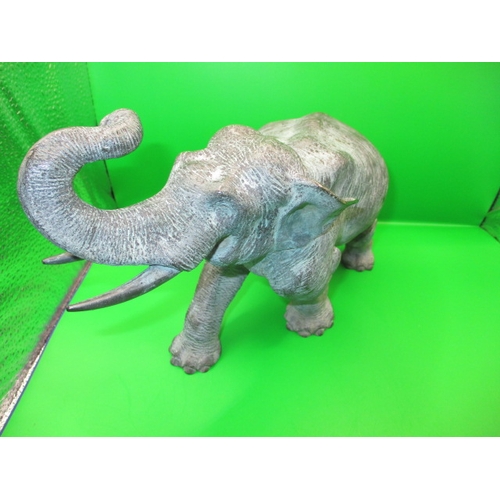 269 - An antique cast bronze elephant, having been used in a garden display for the late 30+ years, approx... 