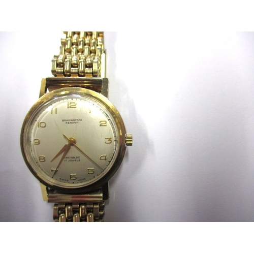 102 - A vintage Bravingtons Renown 9ct gold cased wrist watch, in current working order with rolled gold s... 