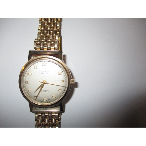 102 - A vintage Bravingtons Renown 9ct gold cased wrist watch, in current working order with rolled gold s... 