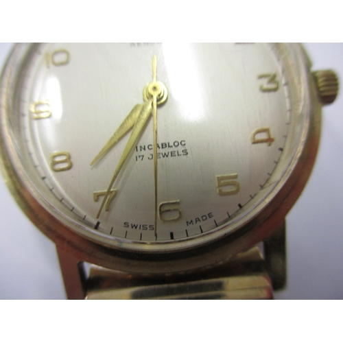 102 - A vintage Bravingtons Renown 9ct gold cased wrist watch, in current working order with rolled gold s... 