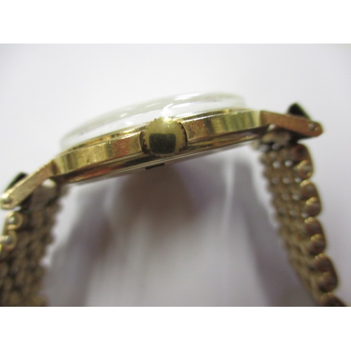 102 - A vintage Bravingtons Renown 9ct gold cased wrist watch, in current working order with rolled gold s... 