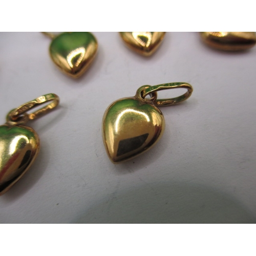 64 - A parcel of 9ct gold charms, pyramid and heart shaped, approx. parcel weight 19.7, all in unused con... 