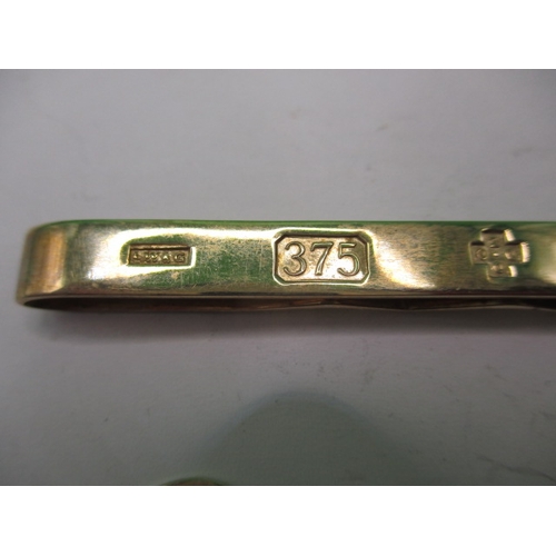 70 - A 9ct yellow gold tie clip and a pair of diamond and gold cufflinks, approx. gross parcel weight 16.... 