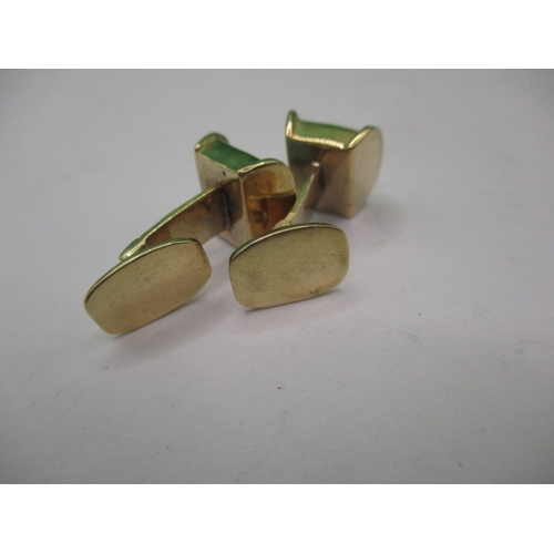 76 - A pair of 750 yellow gold cufflinks set with pale green hard stone panels, approx. gross weight 8.6g... 