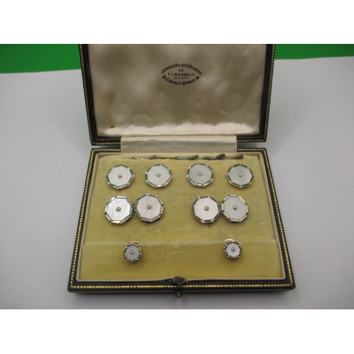 87 - A boxed set of cufflinks and matching studs, all marked 9 & 18ct, in good near unused condition