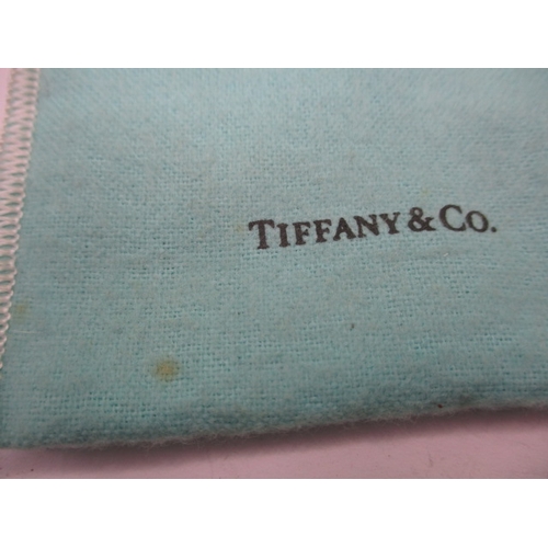 147 - A genuine Tiffany & Co silver key ring with original bag and card, purchased from Tiffany store in N... 