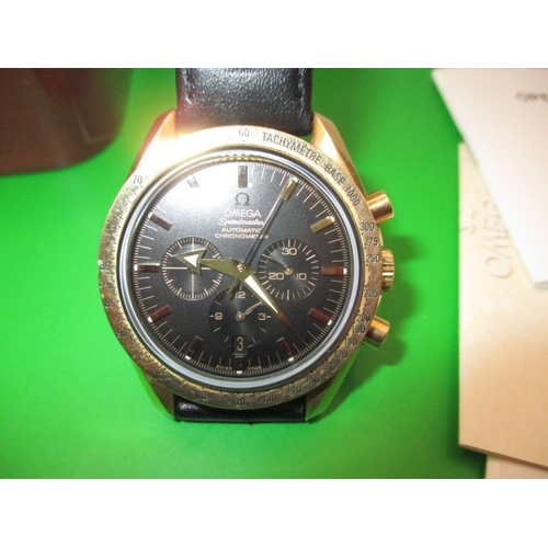 104 - An 18ct gold cased Omega Speedmaster automatic chronometer watch, with box and paperwork, dated 2002... 