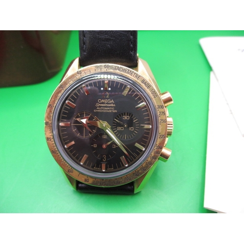 104 - An 18ct gold cased Omega Speedmaster automatic chronometer watch, with box and paperwork, dated 2002... 